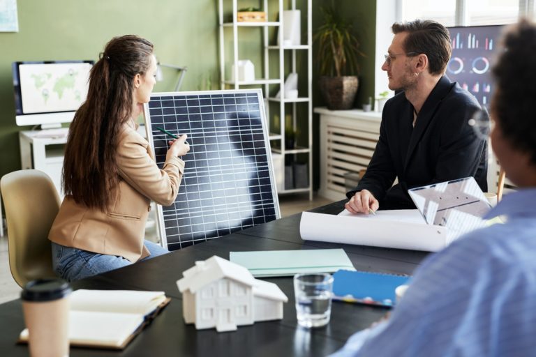 Businesswoman presenting new solar panel